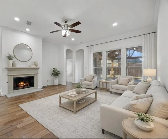 a living room with furniture and a fireplace