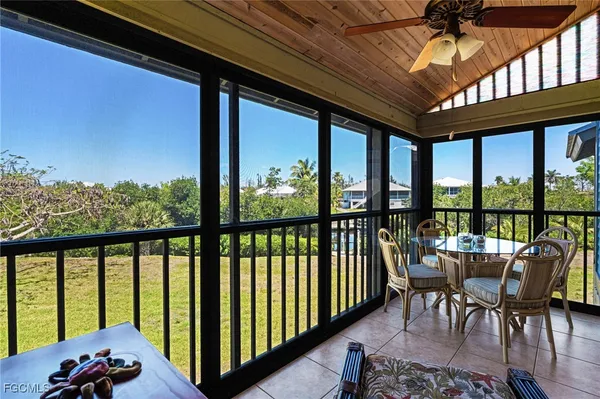 a view of a balcony with furniture