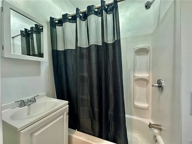a bathroom with a sink and mirror