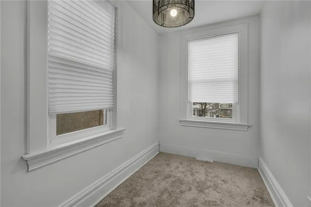 a view of two sink and a window