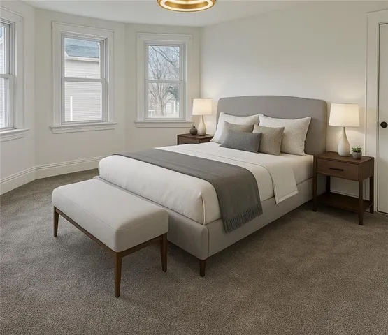 a bedroom with a bed and window