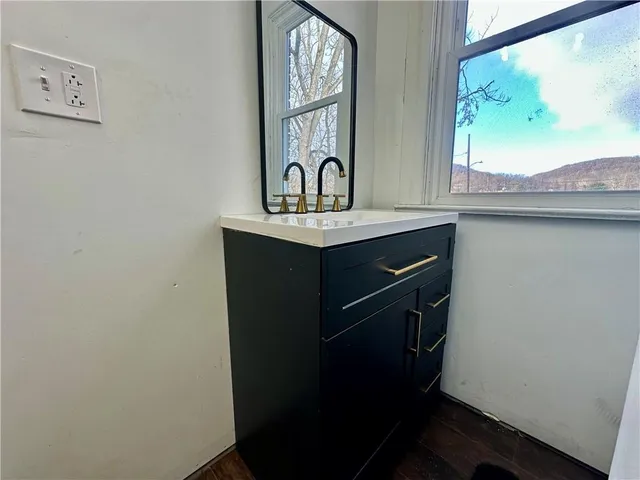 a bathroom with a sink and a mirror