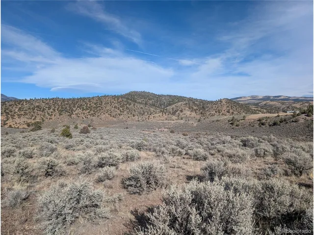 a view of mountain view with trees