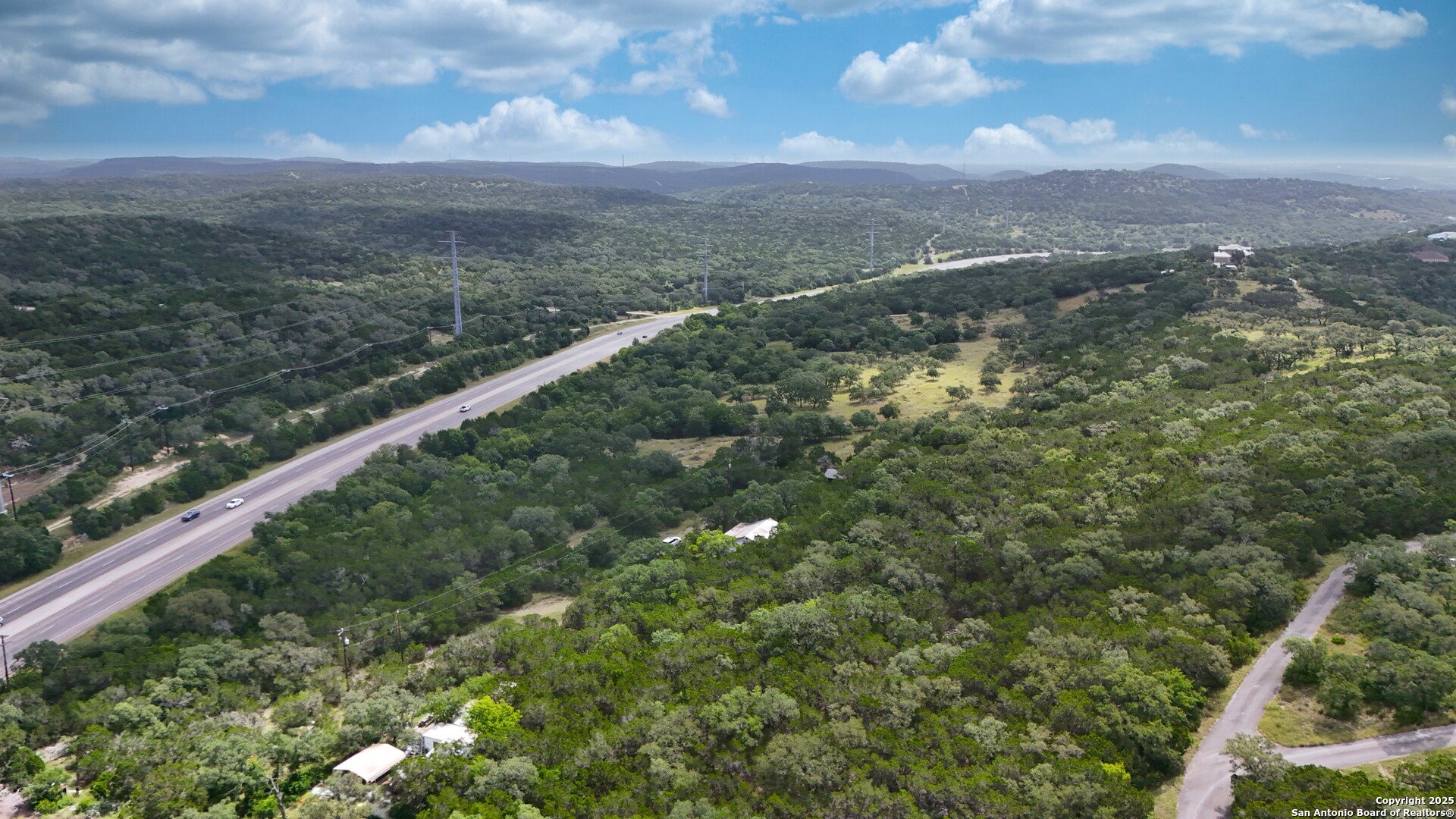 19031 Bandera Road Helotes, TX 78023 - Photo 14 of 37 a view of a city with lush green forest