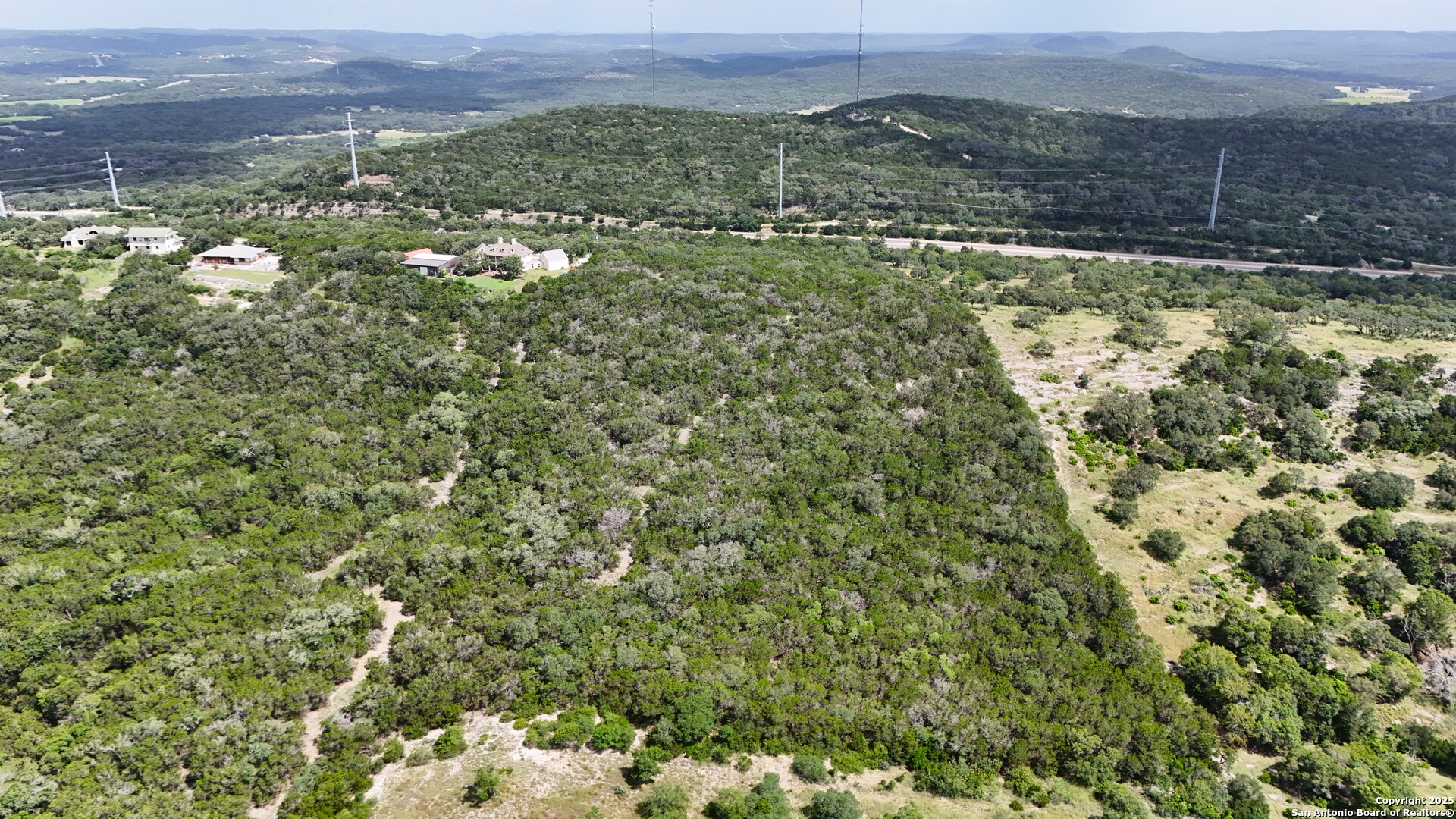 19031 Bandera Road Helotes, TX 78023 - Photo 16 of 37 a view of a town with mountains in the background