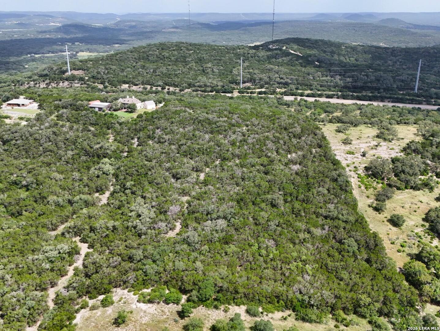19031 Bandera Road Helotes, TX 78023 - Photo 17 of 37 a view of a big yard with lots of green space