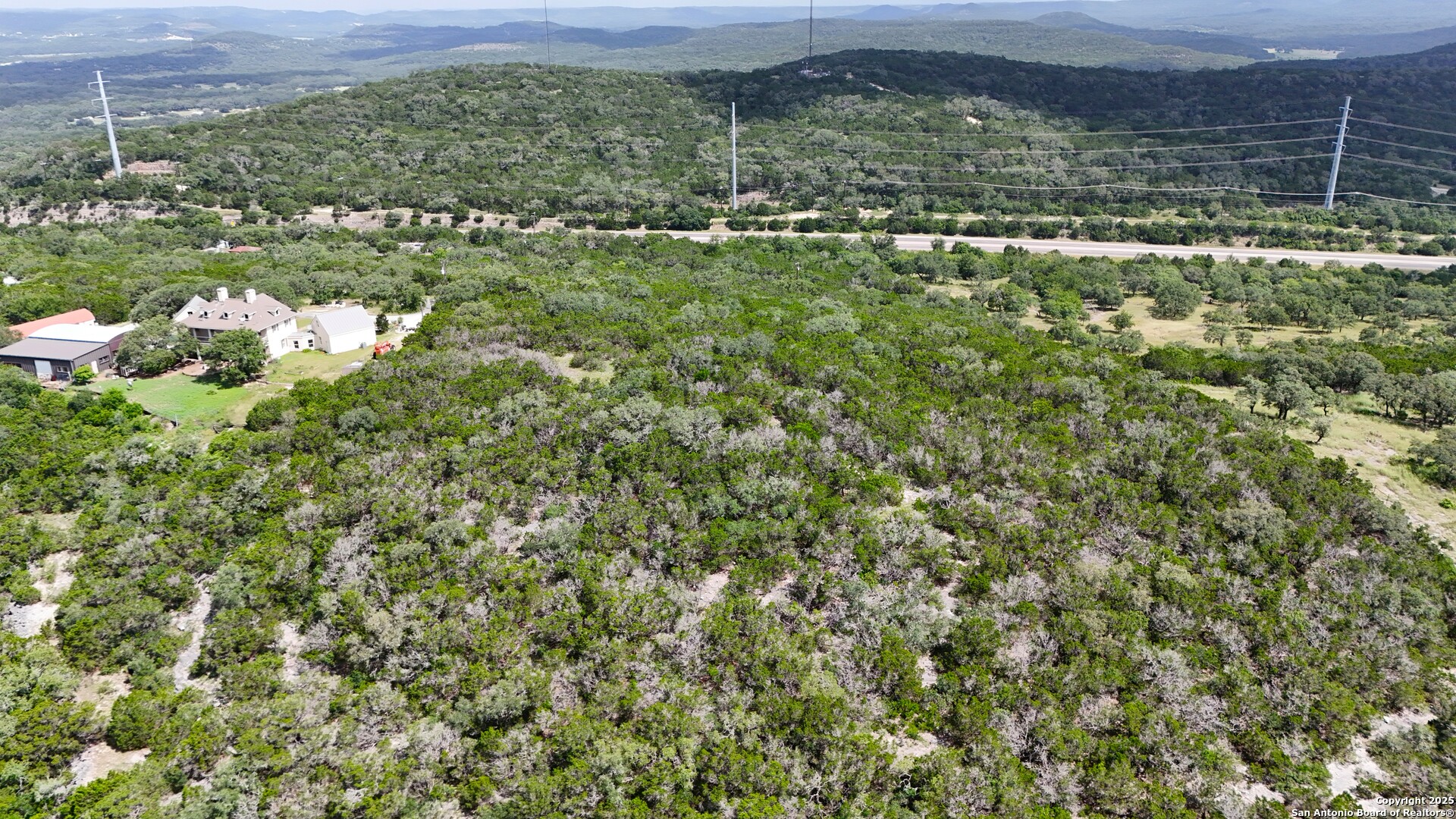 19031 Bandera Road Helotes, TX 78023 - Photo 19 of 37 a view of a bunch of trees and houses