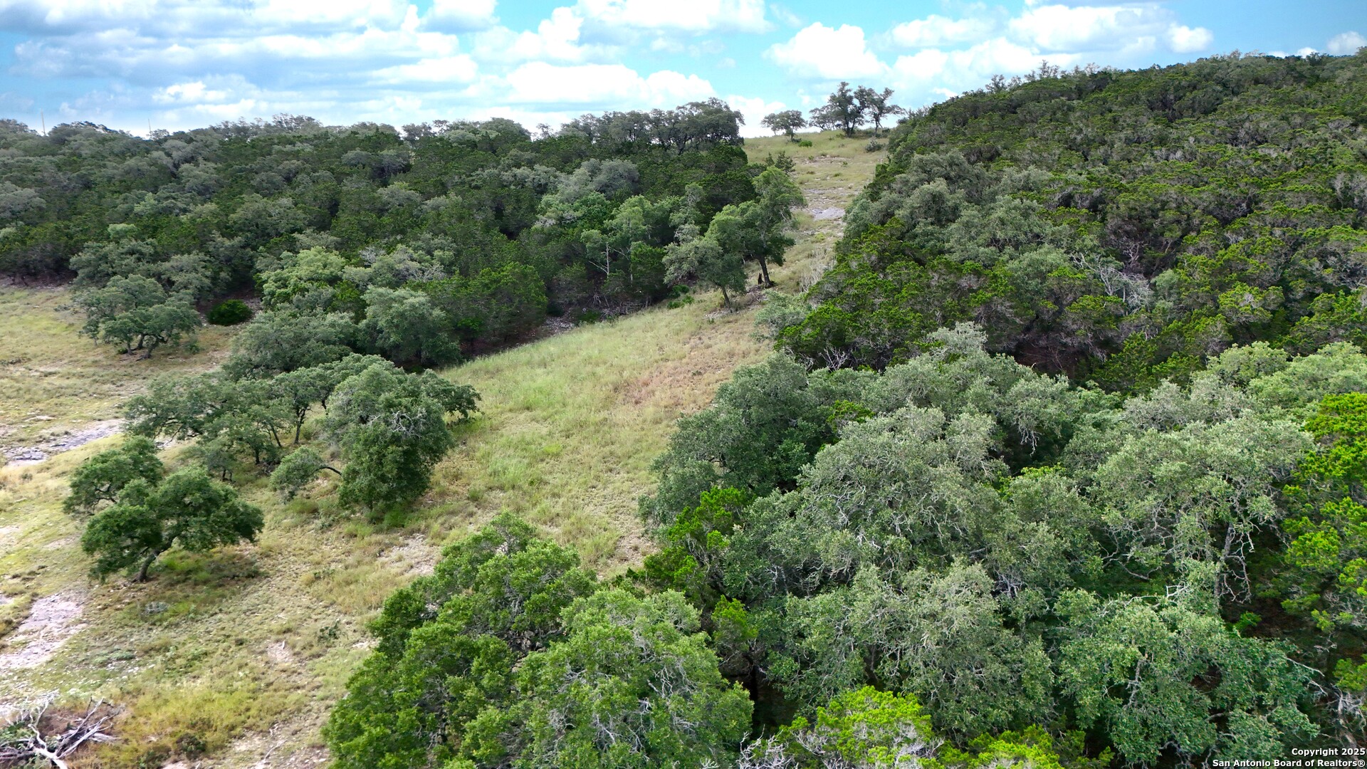 19031 Bandera Road Helotes, TX 78023 - Photo 22 of 37 an aerial view of a forest with houses