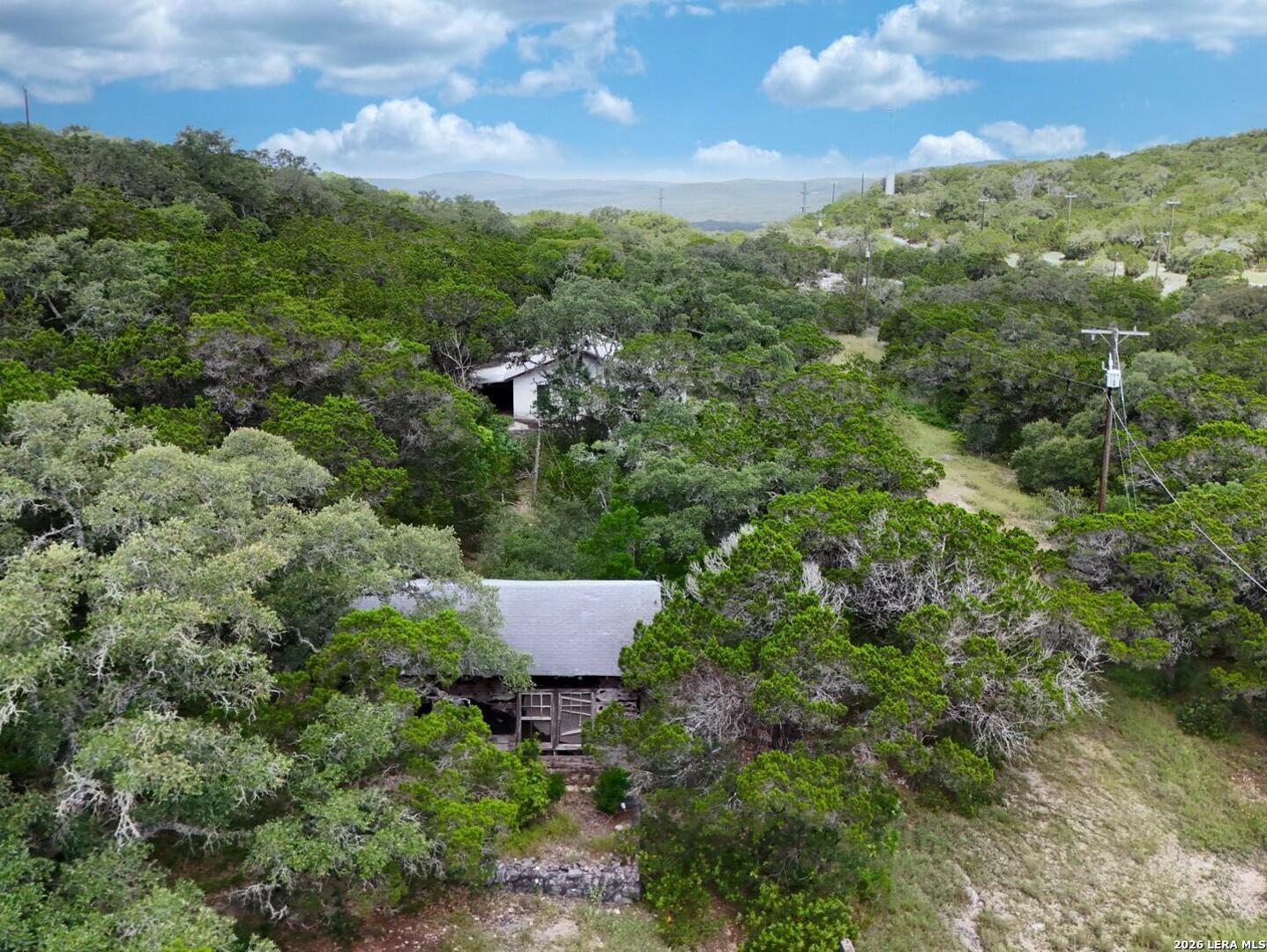19031 Bandera Road Helotes, TX 78023 - Photo 22 of 37 an aerial view of a house with yard and outdoor seating