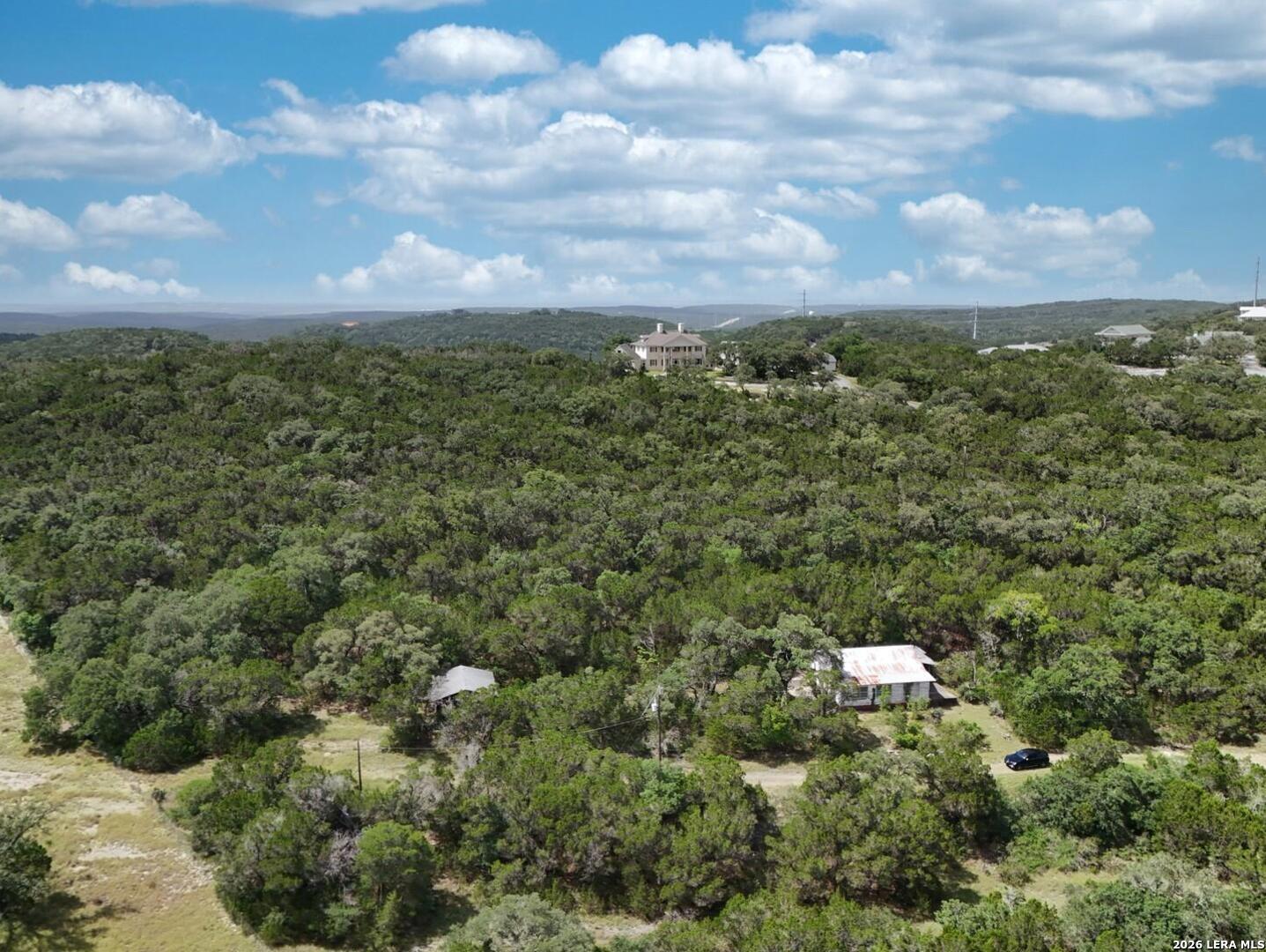 19031 Bandera Road Helotes, TX 78023 - Photo 25 of 37 a view of a city with lush green forest