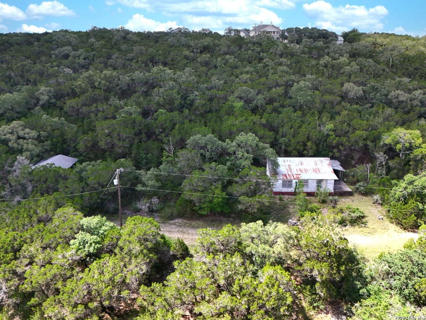 19031 Bandera Road Helotes, TX 78023 - Photo 27 of 37 an aerial view of residential house with outdoor space