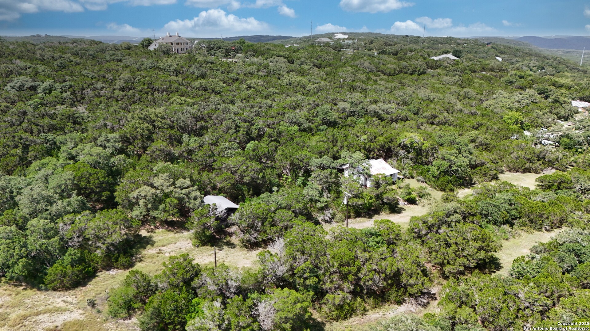 19031 Bandera Road Helotes, TX 78023 - Photo 28 of 37 a view of a city with lush green forest