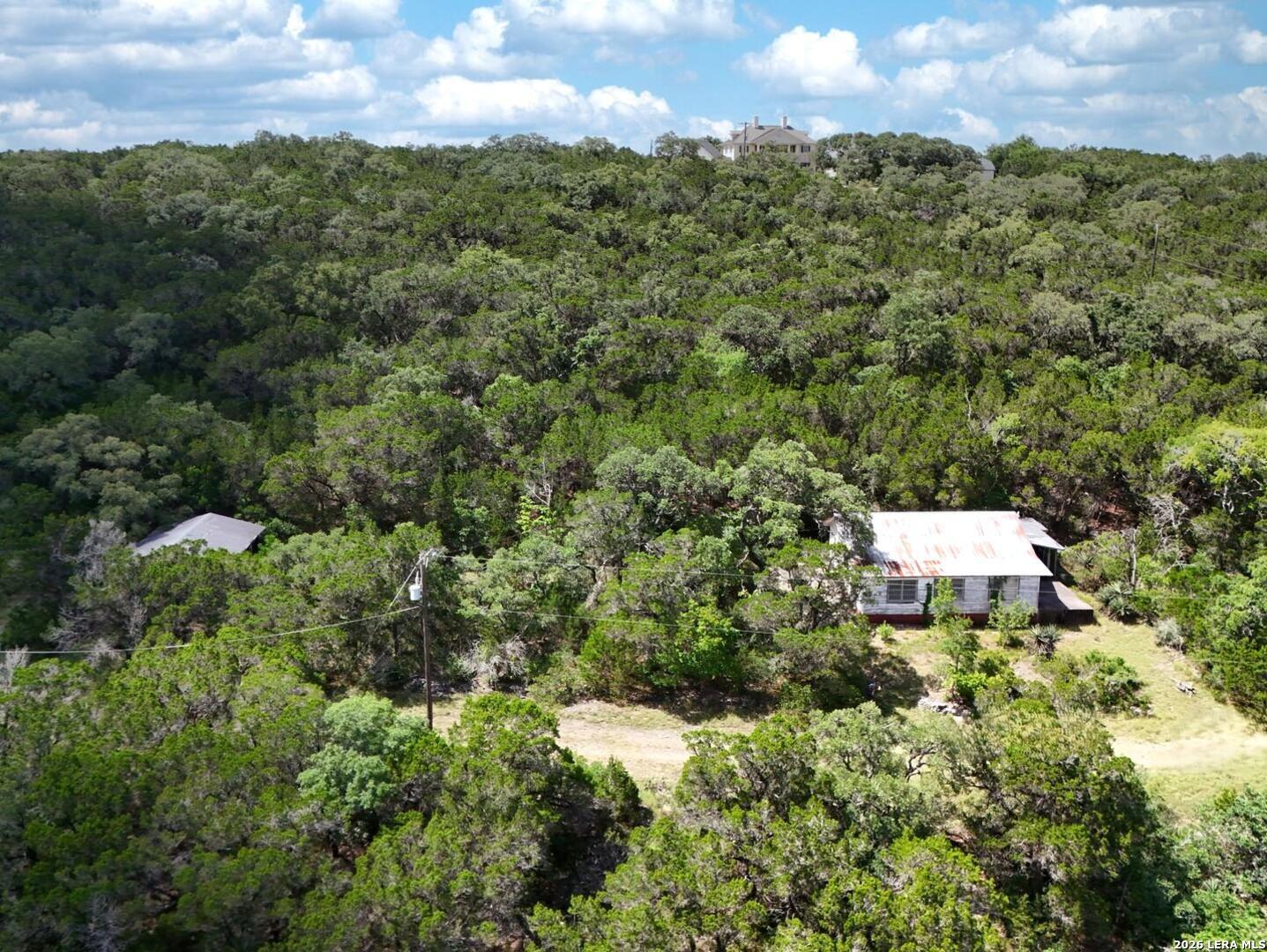 19031 Bandera Road Helotes, TX 78023 - Photo 28 of 37 a view of a city with lush green forest