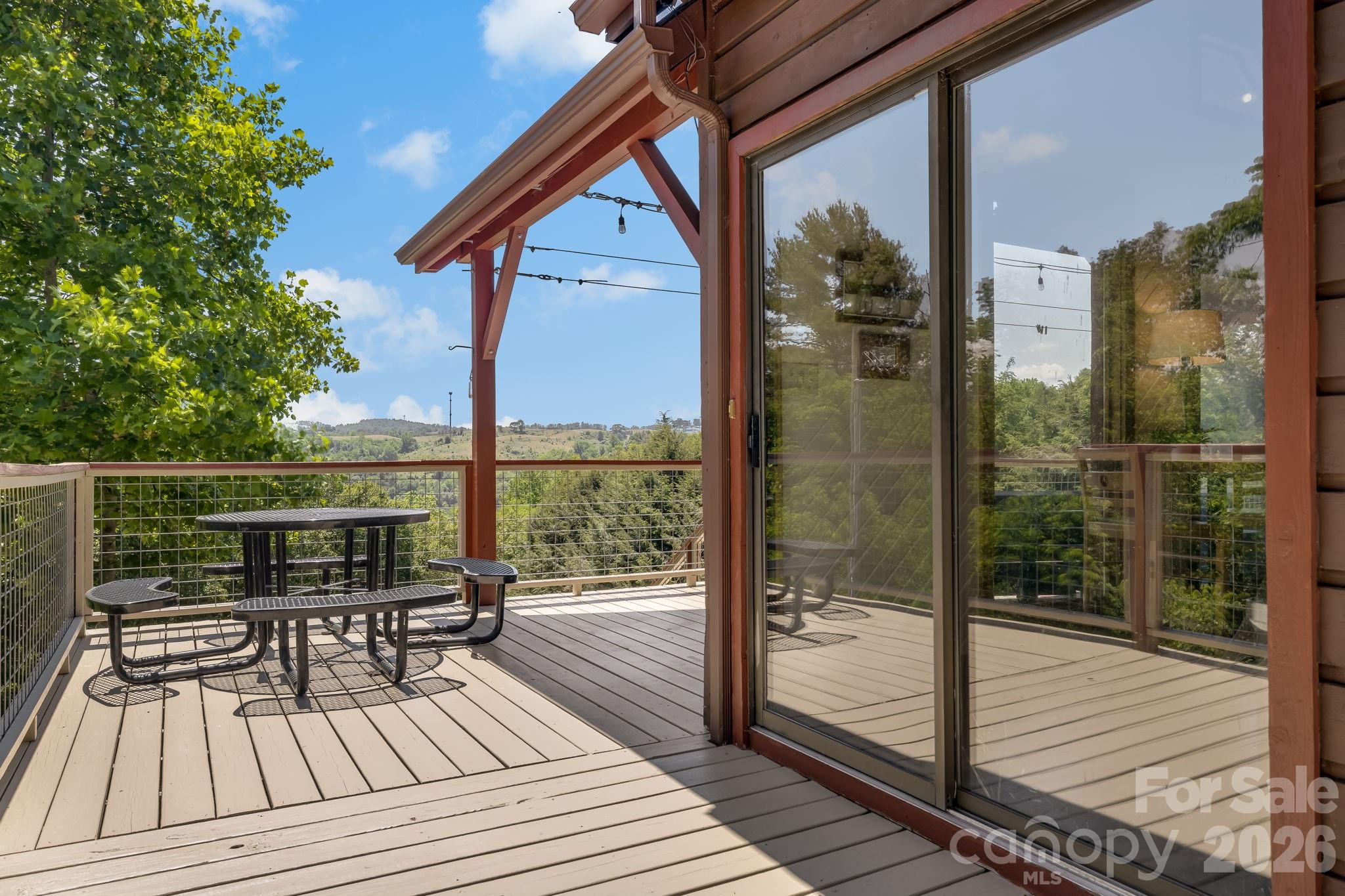 694 Boulder Road Marshall, NC 28753 - Photo 38 of 44 a view of a balcony with wooden floor