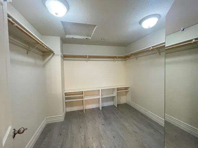 a view of an empty walk in closet