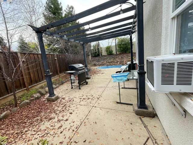 a view of a patio with a table chairs and a patio