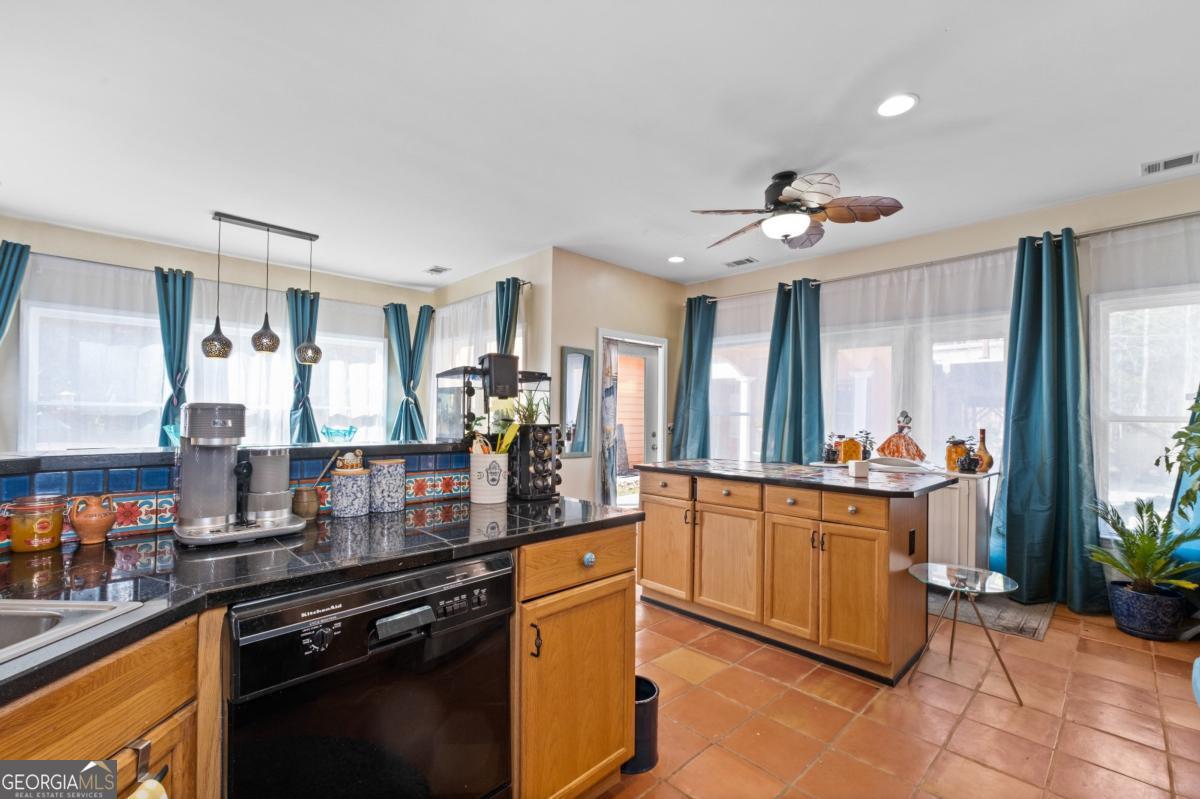 1045 Fincher Road Canton, GA 30114 - Photo 12 of 69 a kitchen with stainless steel appliances granite countertop a stove and a sink