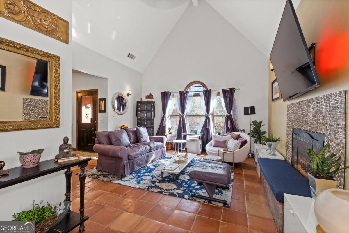 1045 Fincher Road Canton, GA 30114 - Photo 13 of 69 a living room with furniture and a fireplace