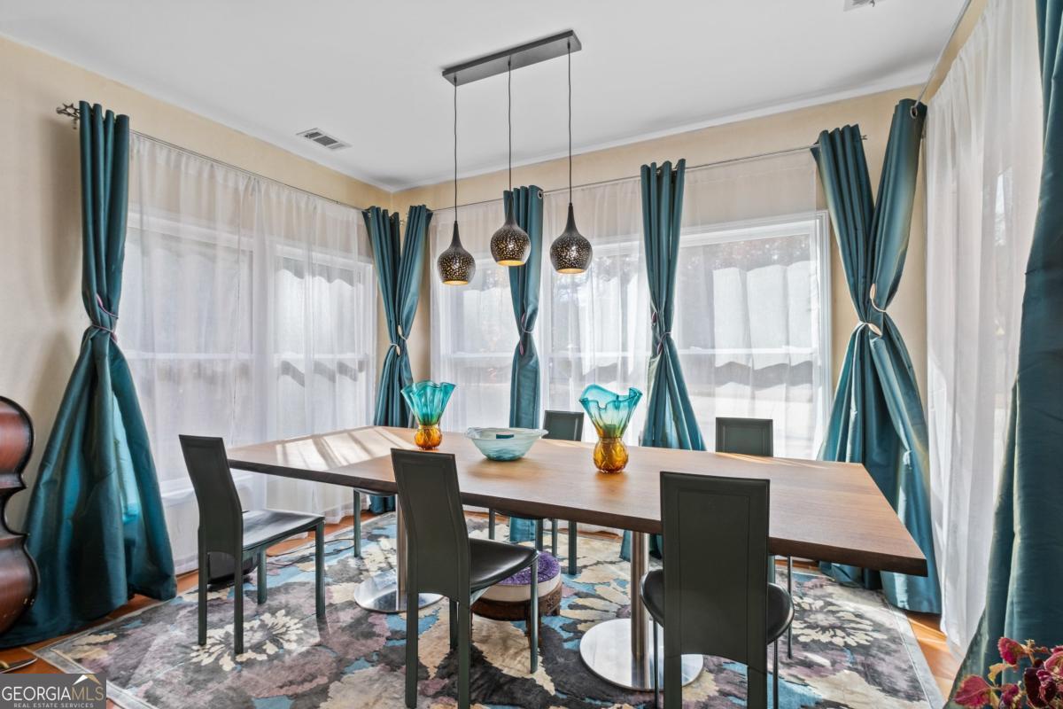 1045 Fincher Road Canton, GA 30114 - Photo 14 of 69 a view of a dining room with furniture window and wooden floor