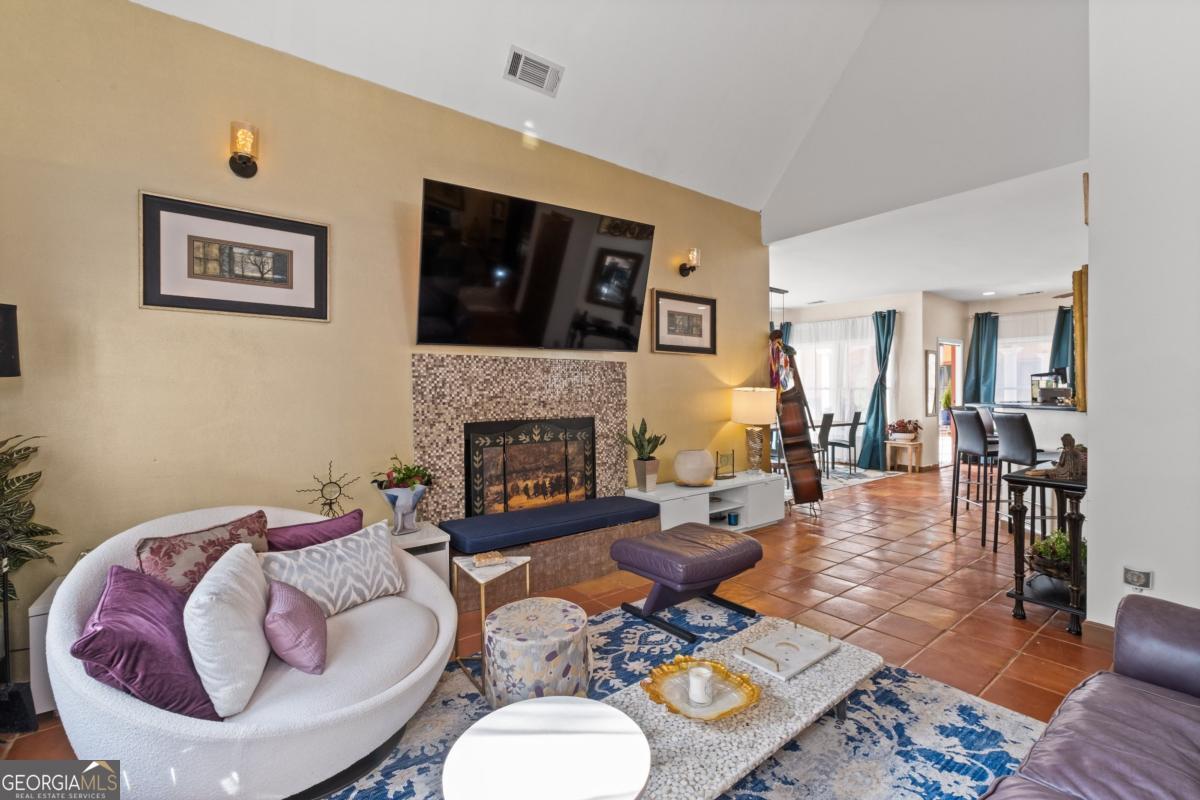 1045 Fincher Road Canton, GA 30114 - Photo 17 of 69 a living room with furniture and a fireplace