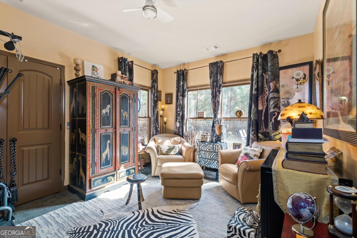 1045 Fincher Road Canton, GA 30114 - Photo 21 of 69 a living room with furniture and a floor to ceiling window