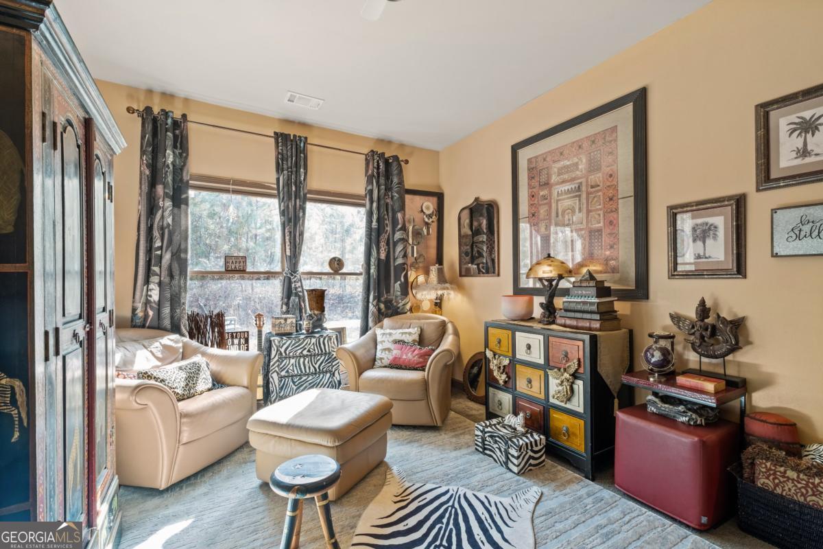 1045 Fincher Road Canton, GA 30114 - Photo 22 of 69 a living room with furniture and a large window