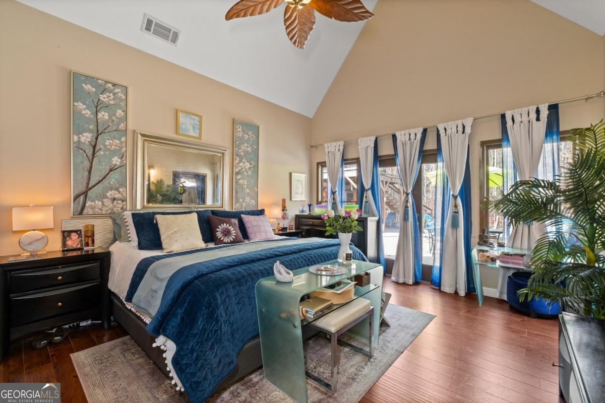 1045 Fincher Road Canton, GA 30114 - Photo 25 of 69 a bed room with furniture and a potted plant