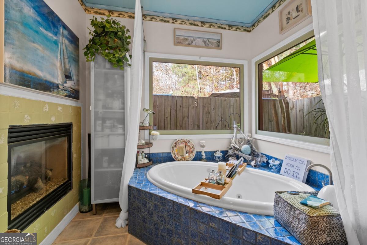 1045 Fincher Road Canton, GA 30114 - Photo 27 of 69 a bath tub sitting in a bathroom next to a tub