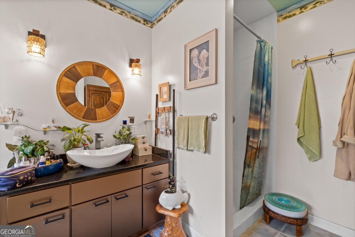 1045 Fincher Road Canton, GA 30114 - Photo 29 of 69 a bathroom with a sink mirror and toilet