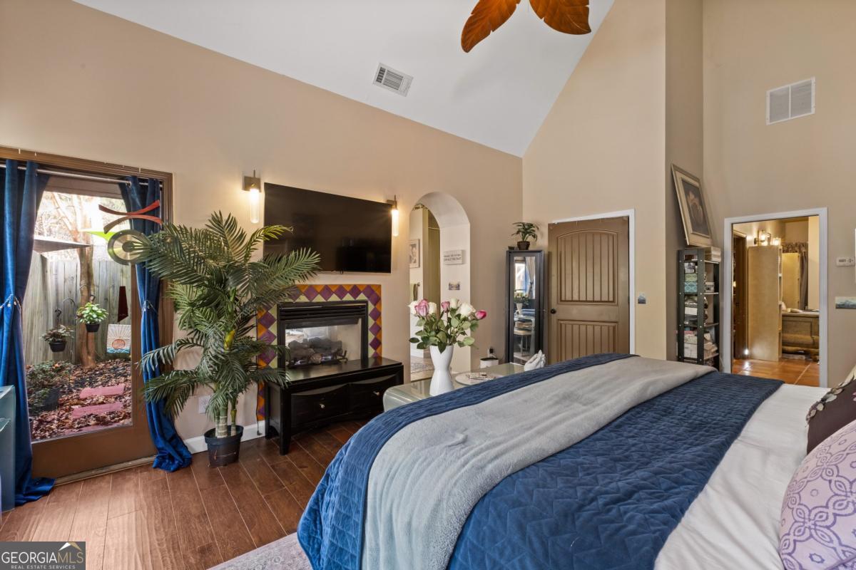 1045 Fincher Road Canton, GA 30114 - Photo 30 of 69 a bedroom with a bed and a flat tv screen on dresser