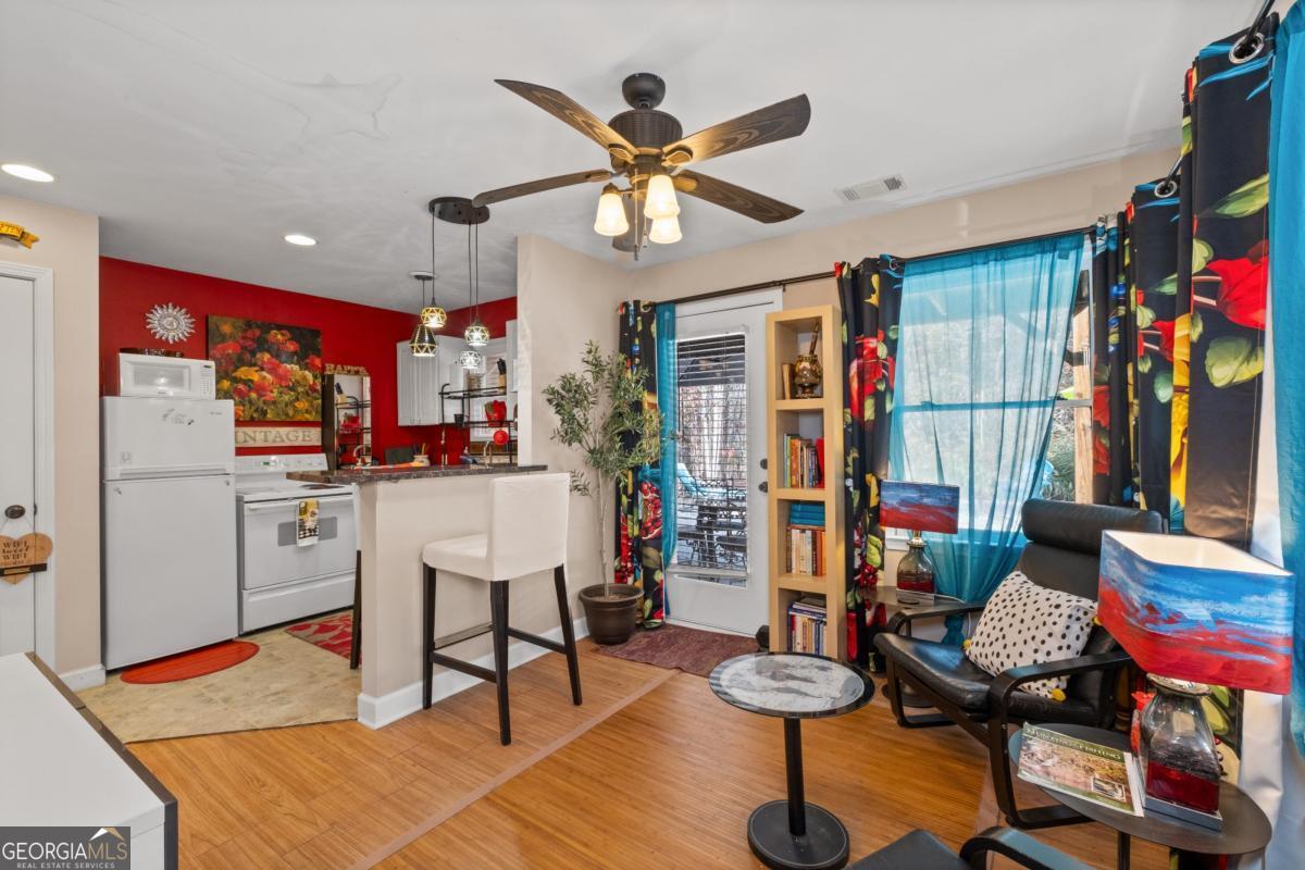 1045 Fincher Road Canton, GA 30114 - Photo 34 of 69 a living room with furniture kitchen view and a window