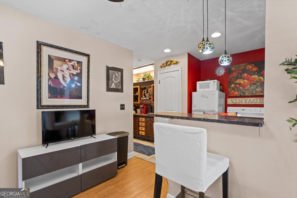 1045 Fincher Road Canton, GA 30114 - Photo 37 of 69 a view of living room with furniture and flat screen tv