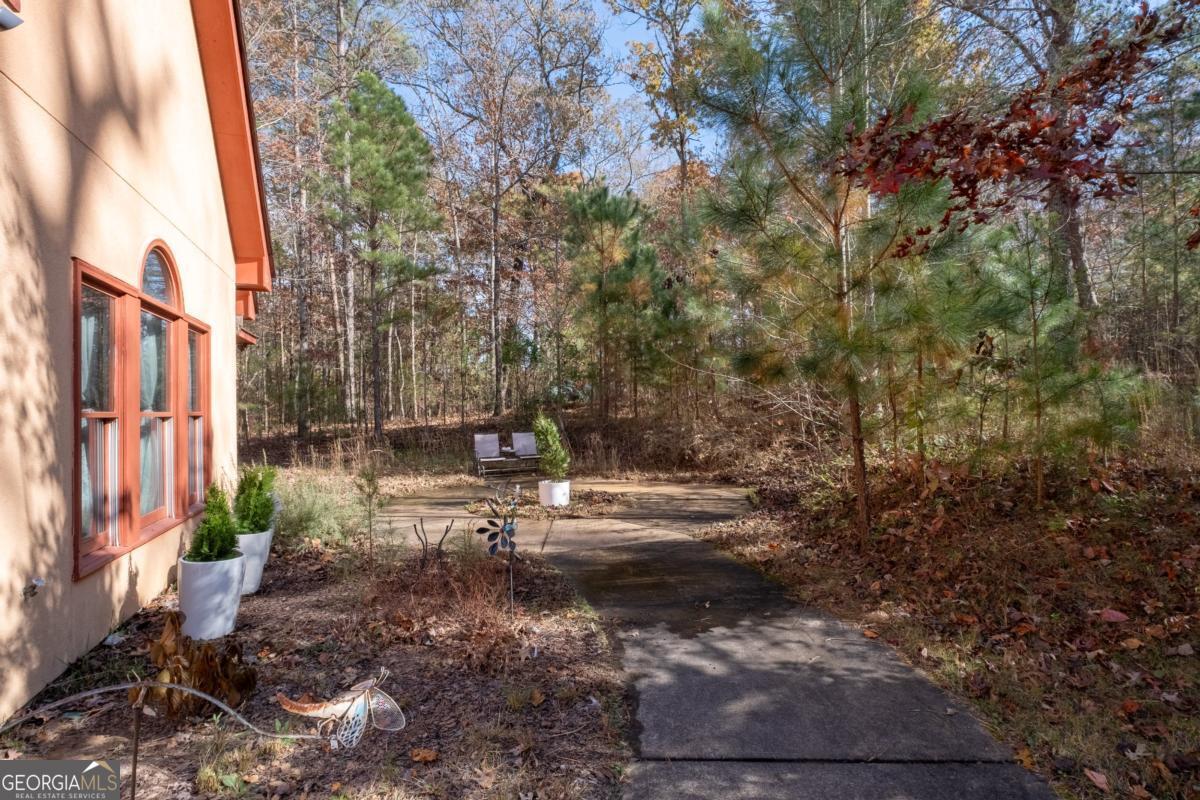 1045 Fincher Road Canton, GA 30114 - Photo 4 of 69 a view of a yard with plants and trees