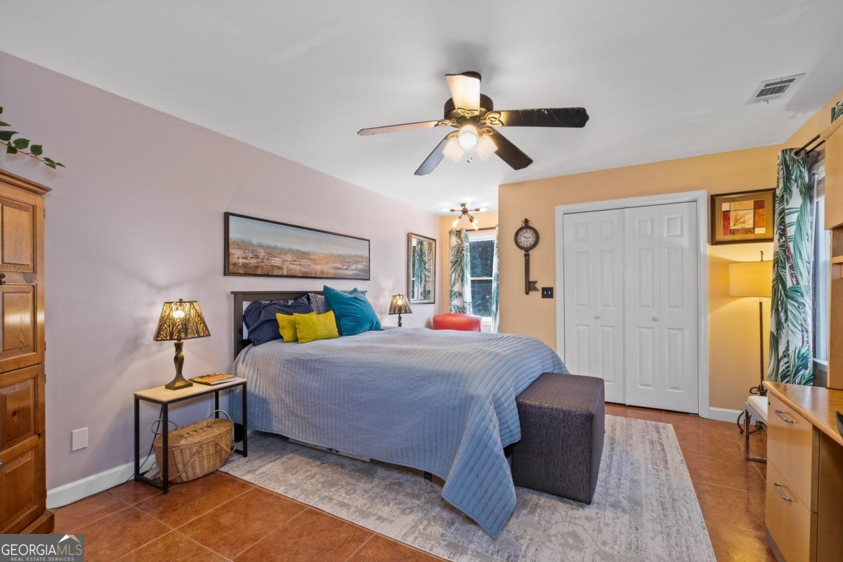 1045 Fincher Road Canton, GA 30114 - Photo 41 of 69 a bed room with a bed and a chandelier