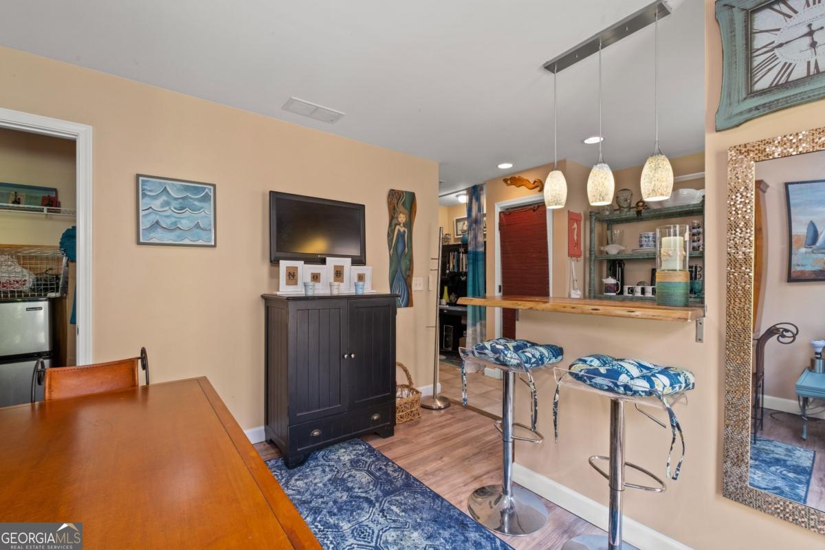 1045 Fincher Road Canton, GA 30114 - Photo 46 of 69 a living room with furniture and a flat screen tv
