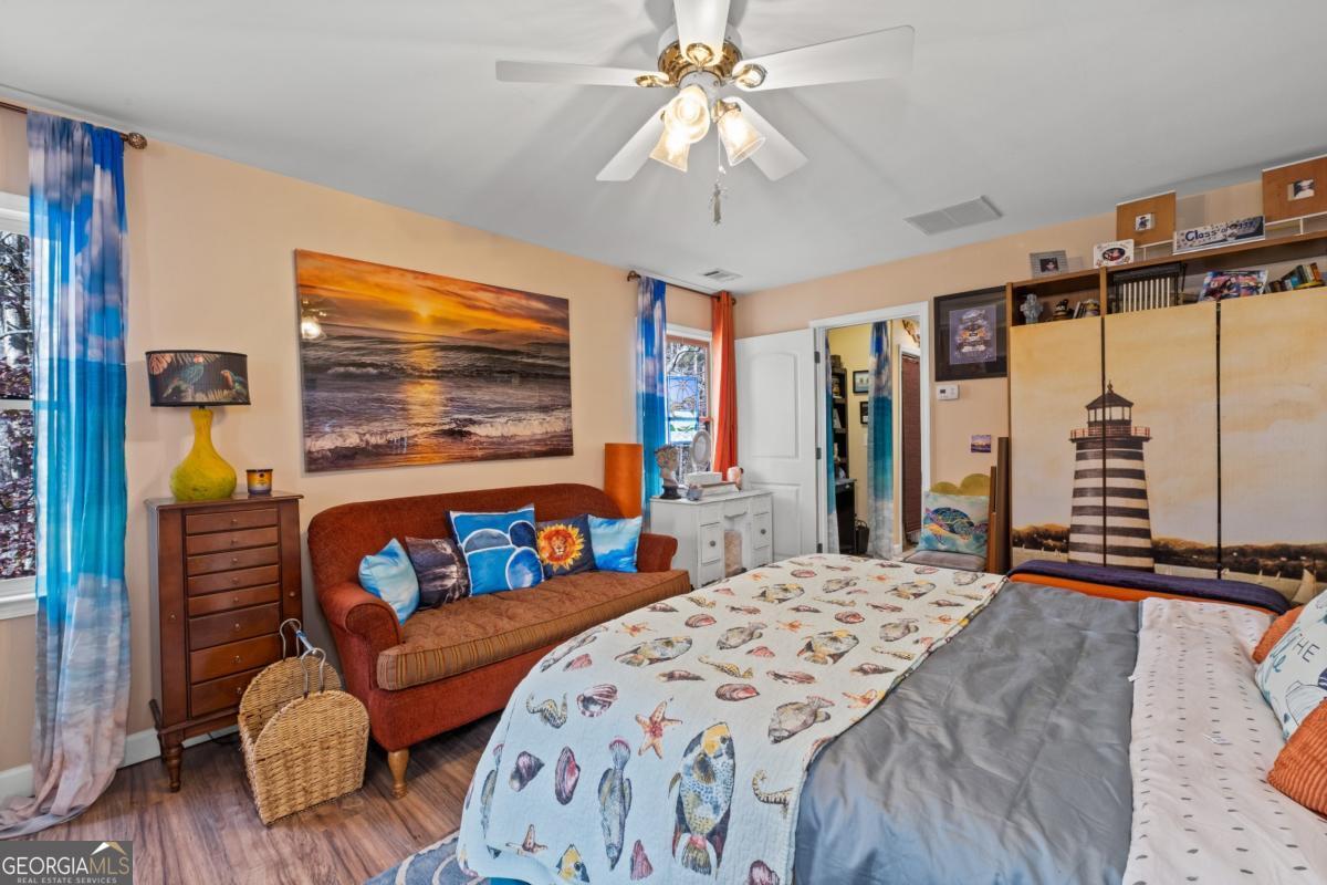 1045 Fincher Road Canton, GA 30114 - Photo 53 of 69 a bedroom with a bed couch and a large window