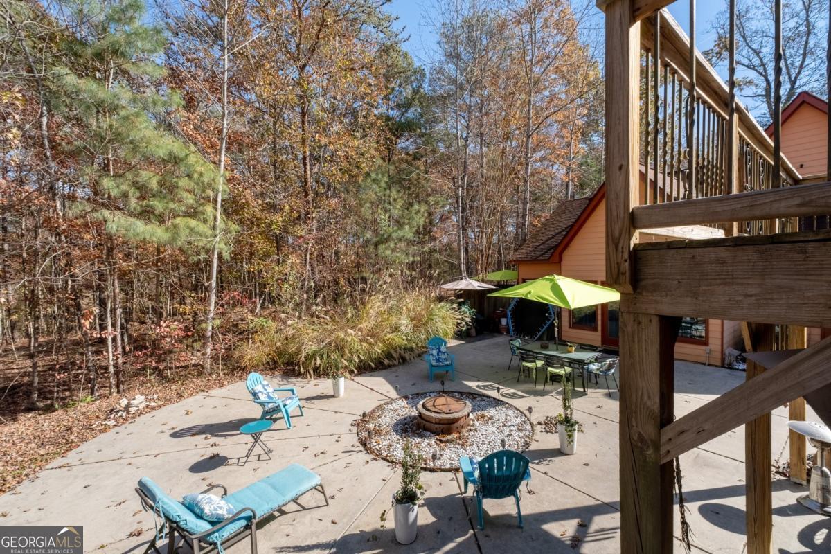 1045 Fincher Road Canton, GA 30114 - Photo 54 of 69 an outdoor space with patio and white umbrellas