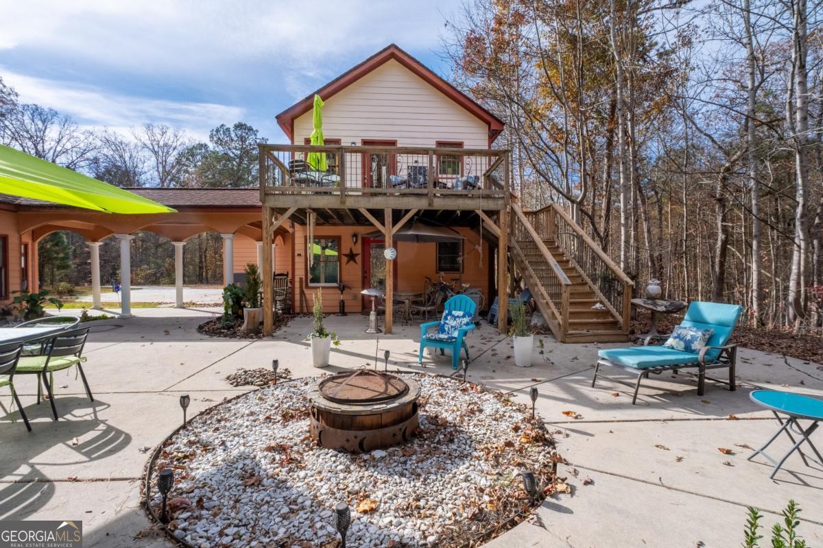 1045 Fincher Road Canton, GA 30114 - Photo 56 of 69 a view of a chairs and tables in patio