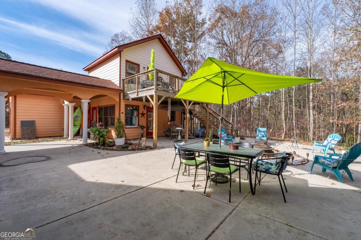 1045 Fincher Road Canton, GA 30114 - Photo 58 of 69 a view of a dinning table and chairs in the patio