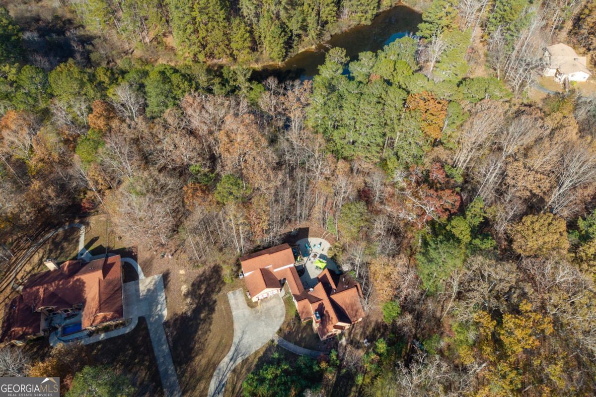 1045 Fincher Road Canton, GA 30114 - Photo 66 of 69 an aerial view of a house with a yard and large trees