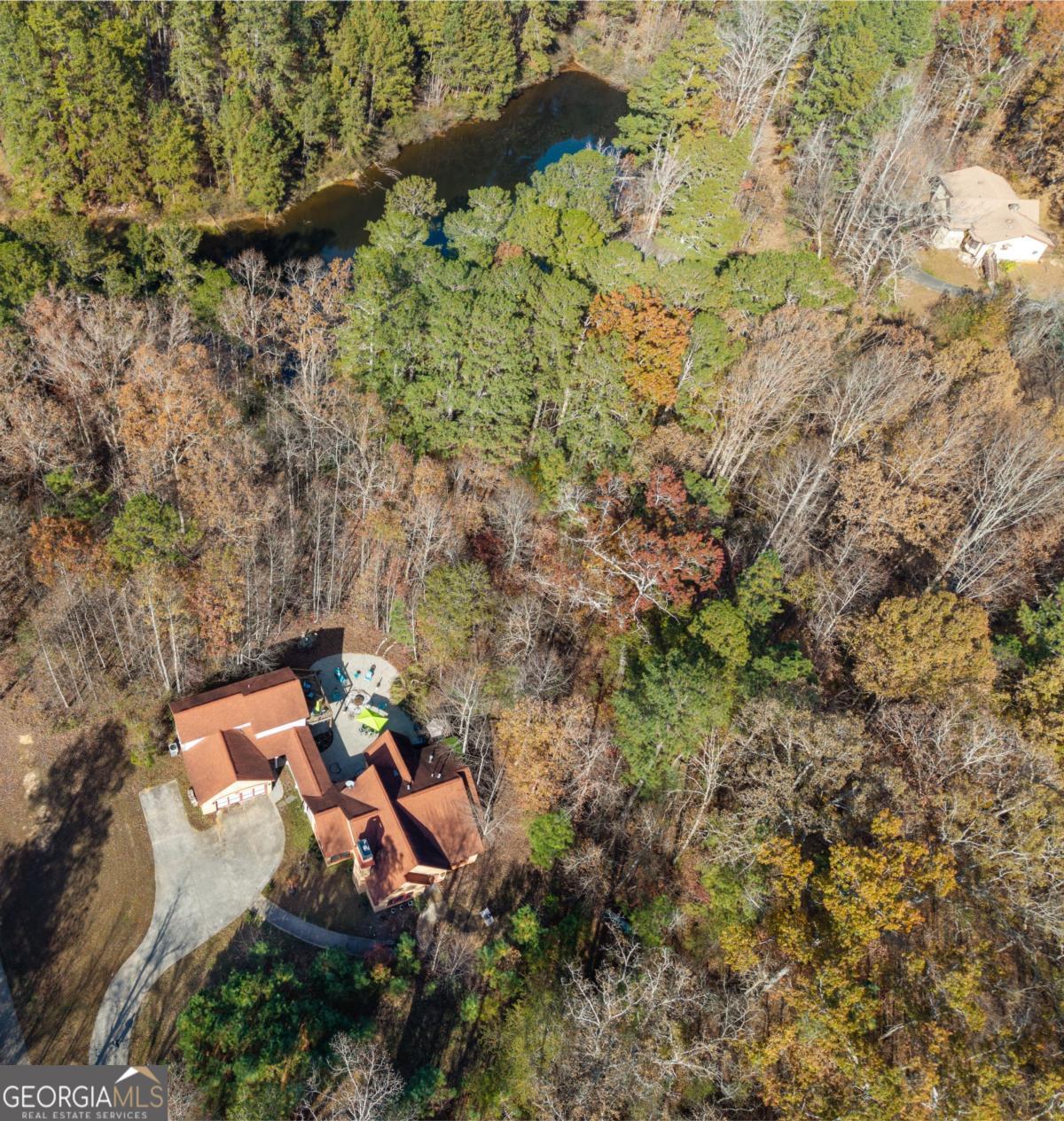 1045 Fincher Road Canton, GA 30114 - Photo 68 of 69 an aerial view of a house with a yard and large trees