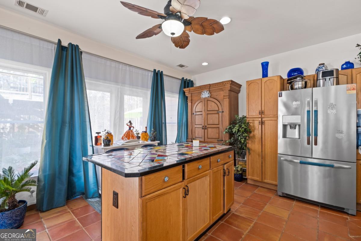 1045 Fincher Road Canton, GA 30114 - Photo 7 of 69 a kitchen with stainless steel appliances granite countertop a refrigerator and a sink