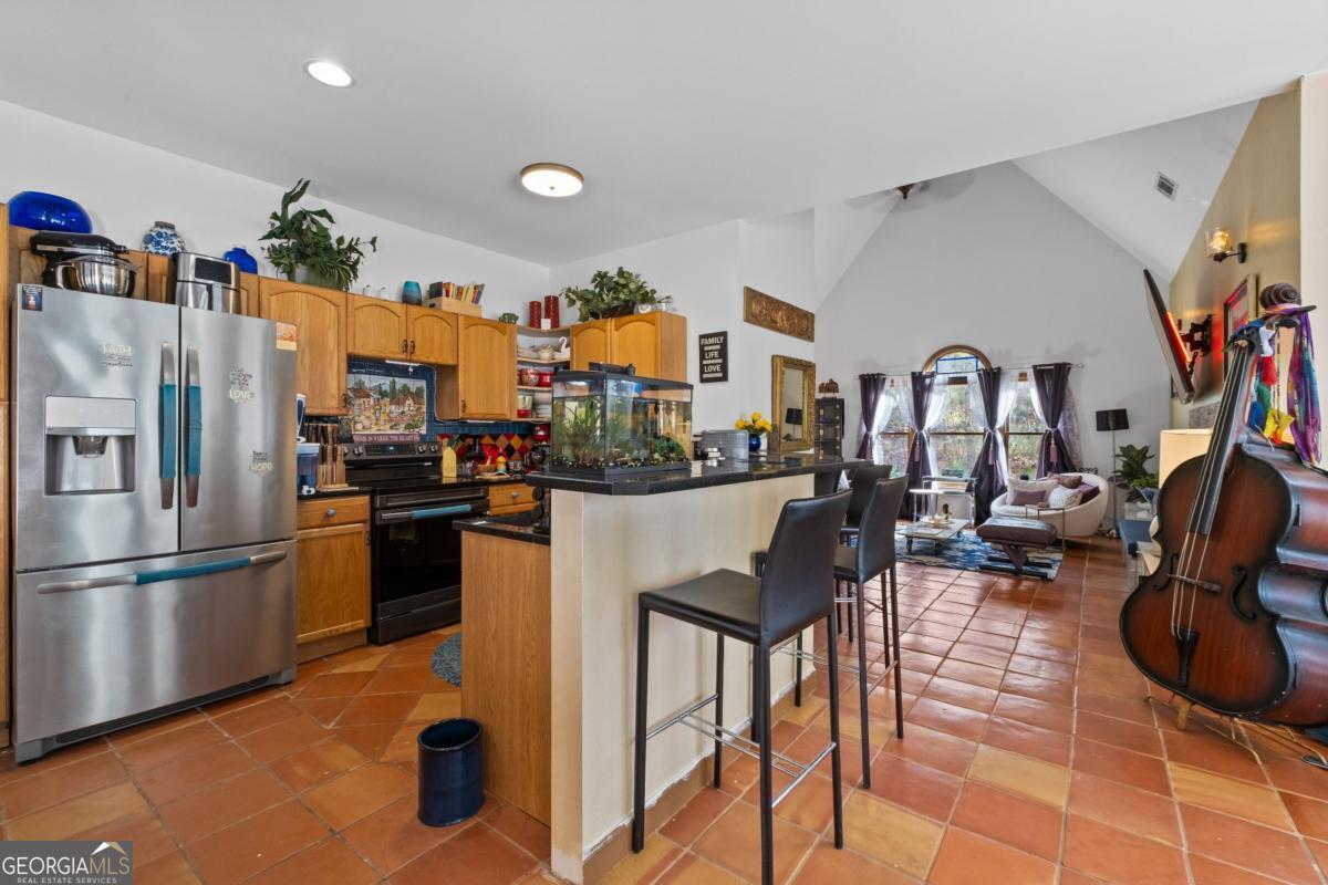 1045 Fincher Road Canton, GA 30114 - Photo 9 of 69 a kitchen with stainless steel appliances granite countertop a refrigerator and a sink