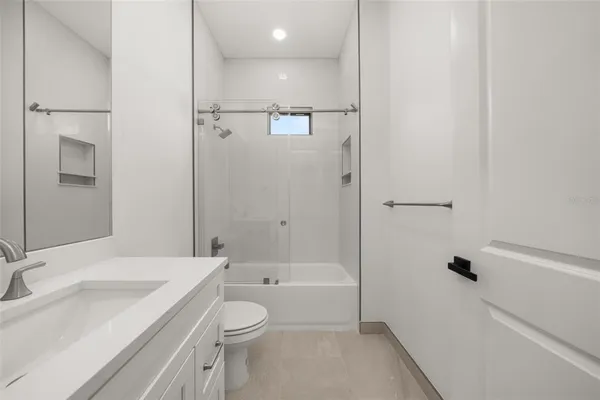 an empty room with a empty space and windows