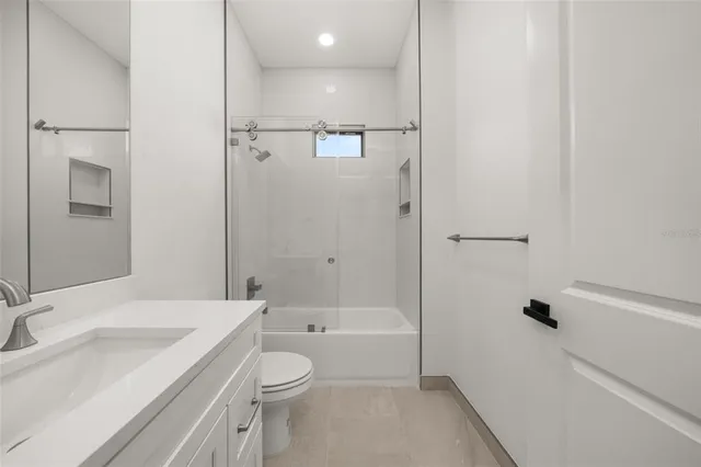 an empty room with a empty space and windows