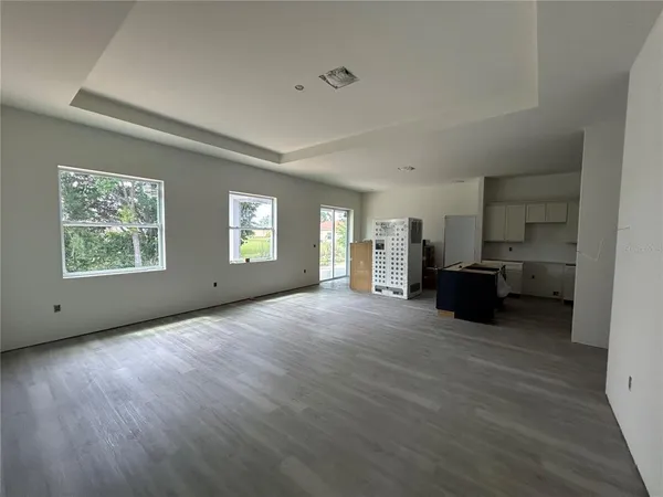 a kitchen with cabinets and a stove