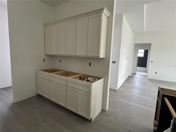 a kitchen with sink cabinets and window