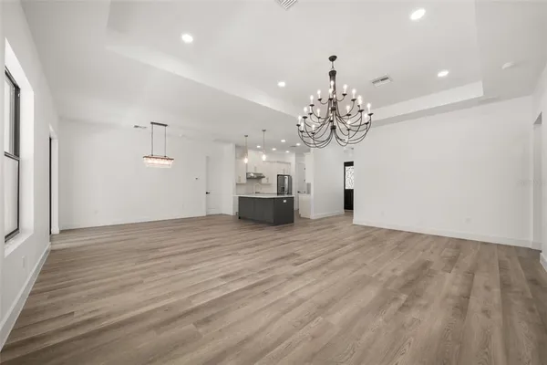 a kitchen with kitchen island a sink stainless steel appliances and cabinets