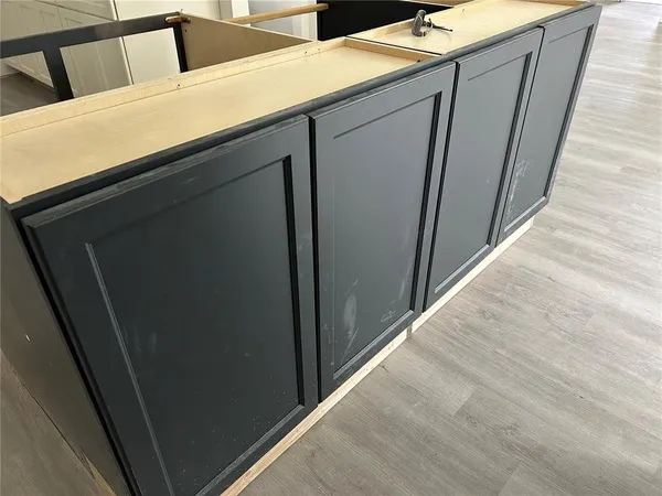 a kitchen with a table and chairs