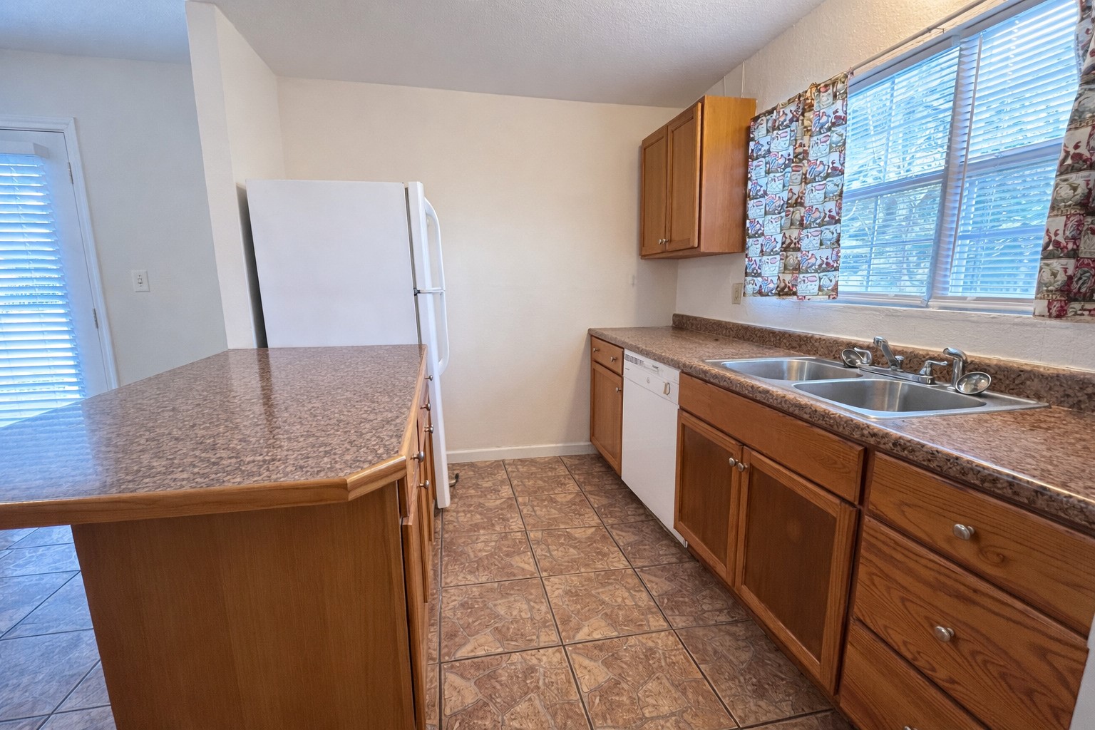 612 Harvey Street Clute, TX 77531 - Photo 3 of 12 a kitchen with stainless steel appliances granite countertop a sink and a granite counter tops